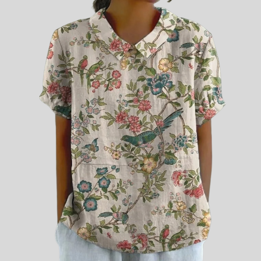 Blusa crema a fiori con scollo a V e maniche corte