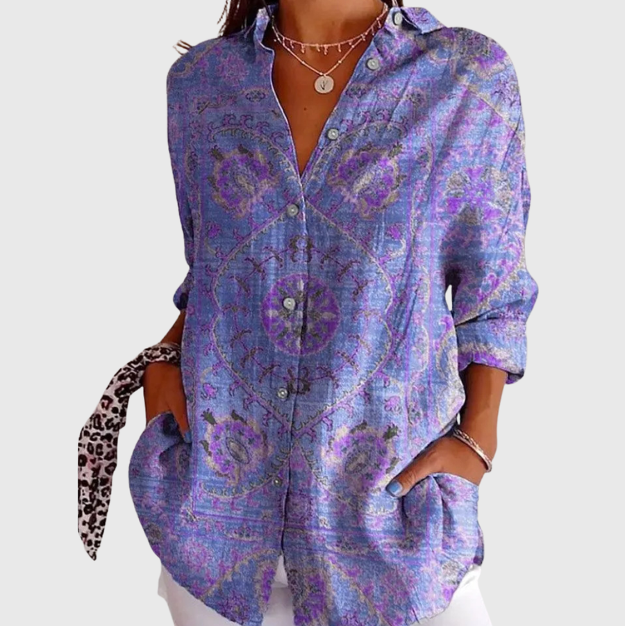 Blusa leggera viola-blu con stampa floreale, maniche lunghe e bottoni.