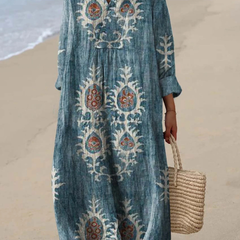 Blue boho maxi dress with colorful folk embroidery, V-neck, long sleeves, relaxed silhouette.