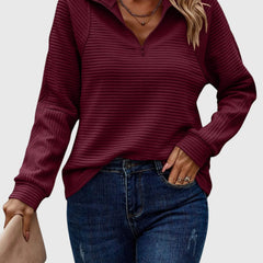 Women’s maroon ribbed knit quarter-zip jumper with long sleeves and knit collar.