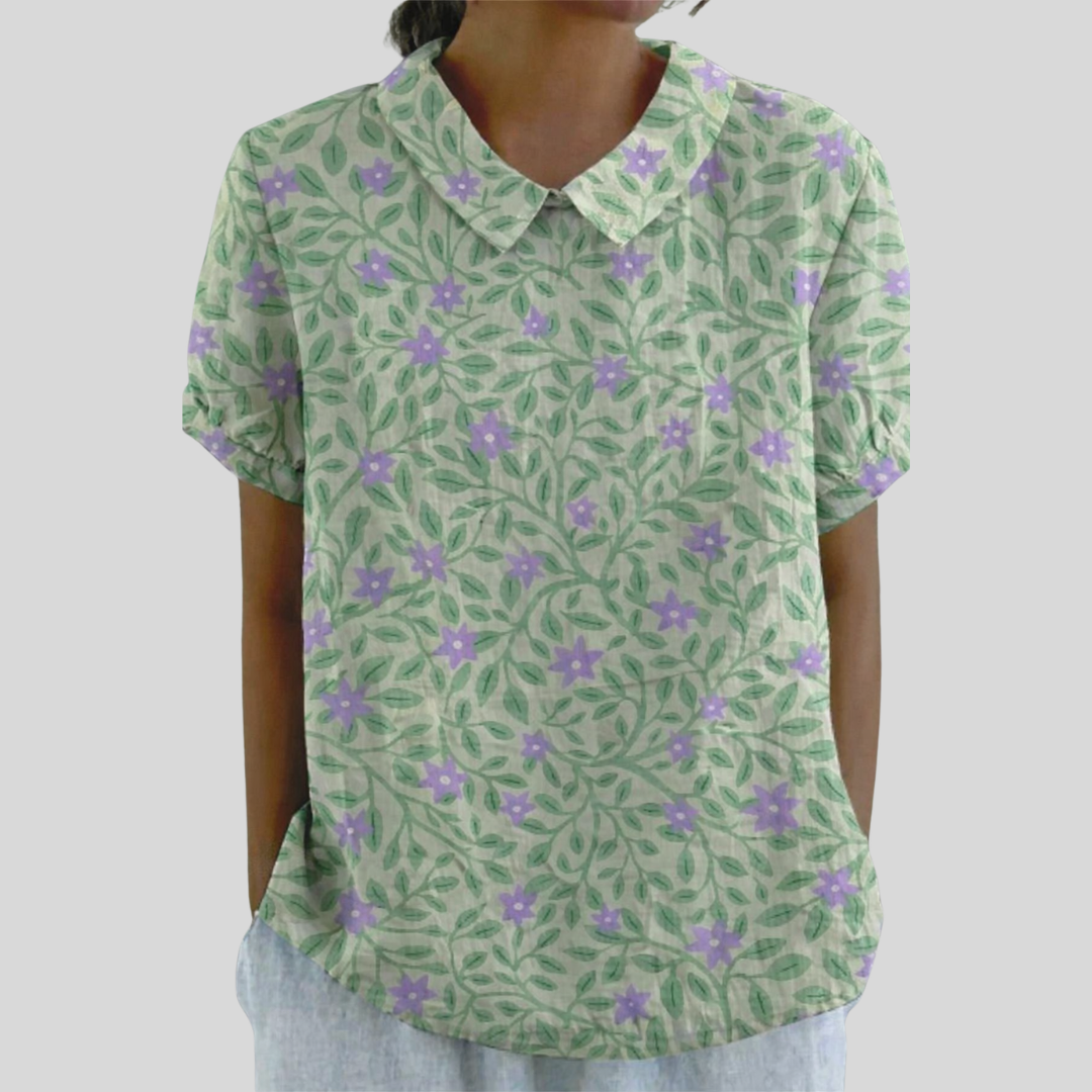Top floreale verde chiaro con colletto e maniche corte, stampa viola.
