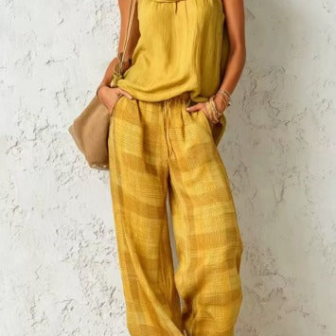Completo estivo con top giallo e pantaloni ampi con tessuto a righe