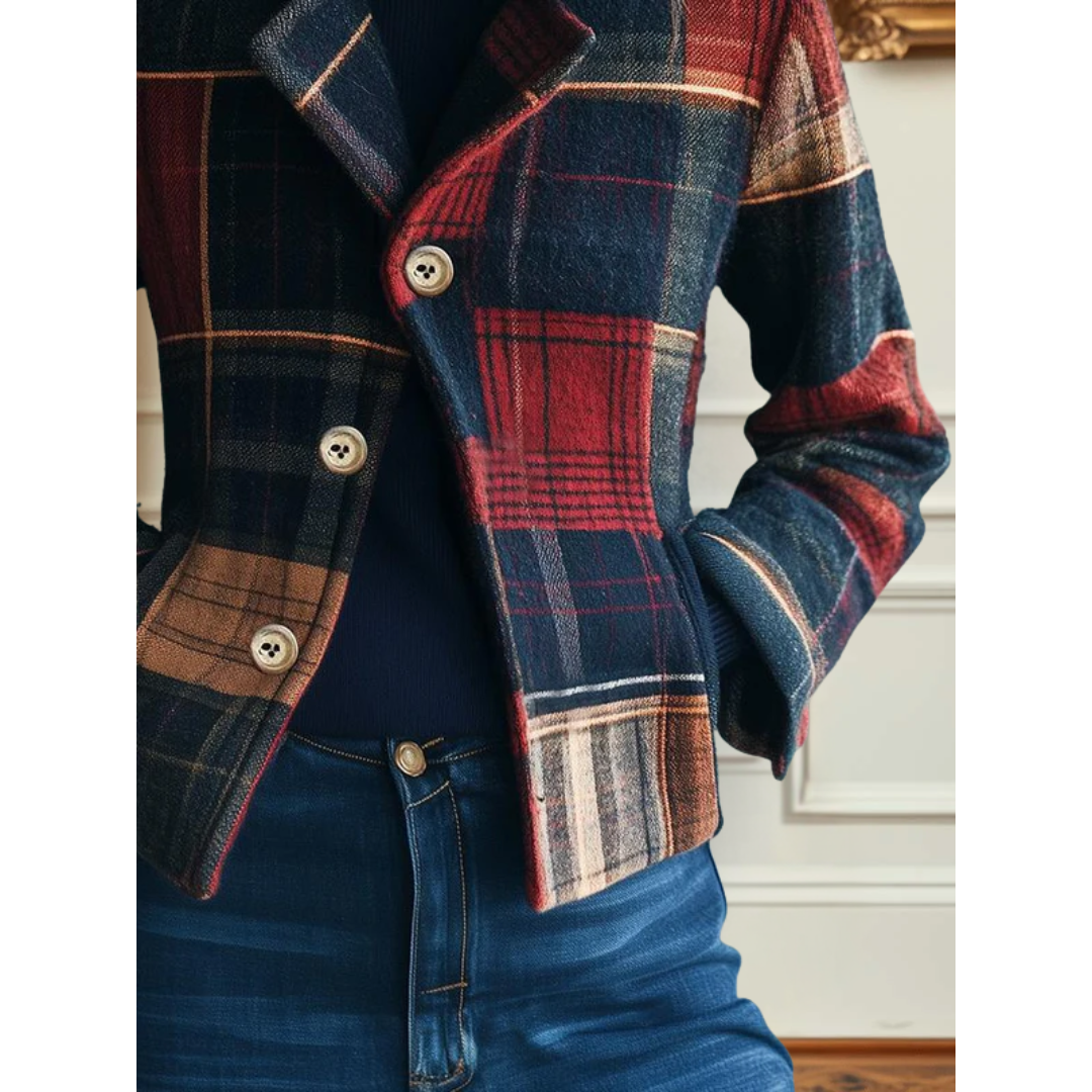 Plaid wool jacket with button closure, curved hem and red blue tartan sleeves.