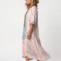 Pink midi dress with turquoise embroidered front and elbow-length sleeves