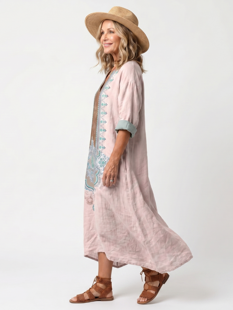 Pink midi dress with turquoise embroidered front and elbow-length sleeves