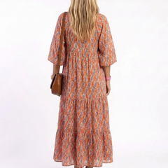 Geometric print V-neck tiered midi dress, orange with blue pattern, gathered tiered back