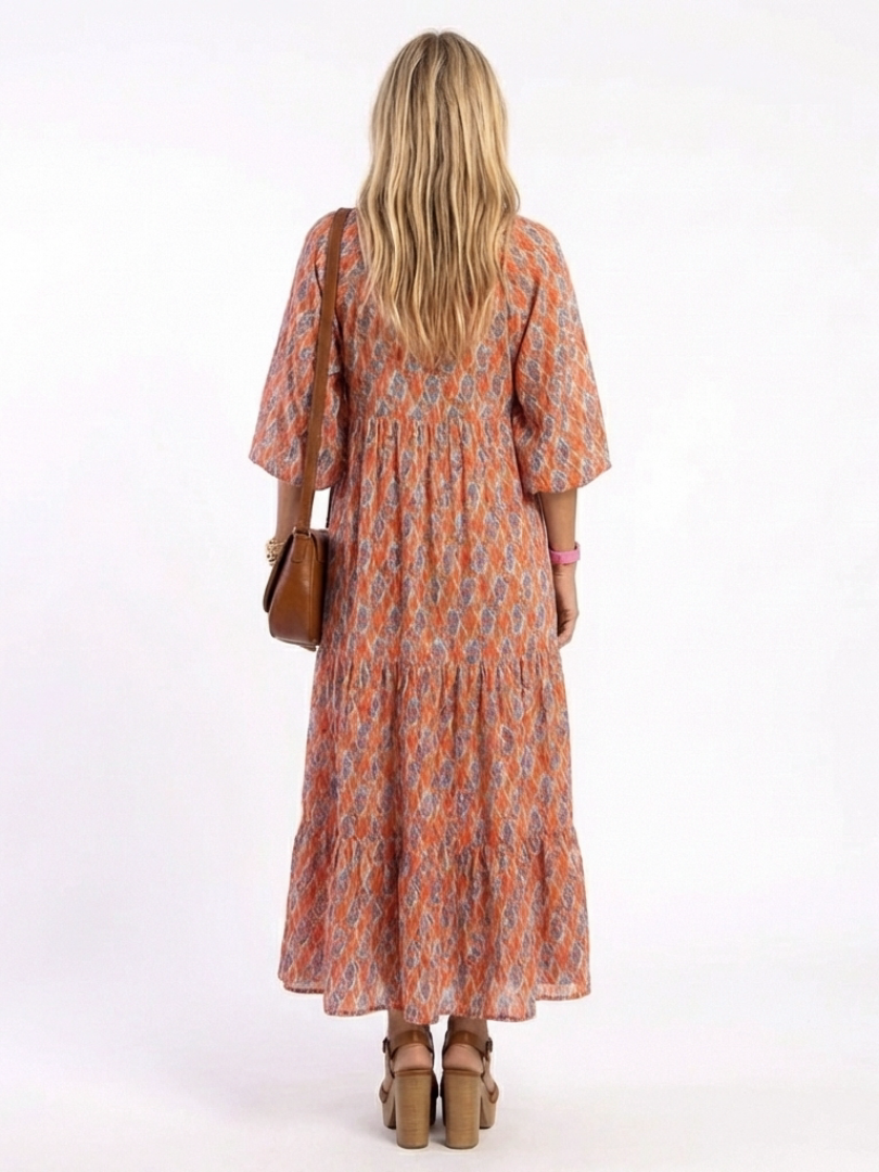 Geometric print V-neck tiered midi dress, orange with blue pattern, gathered tiered back
