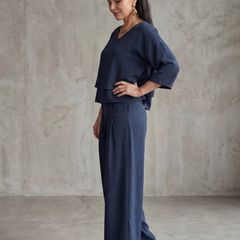 Navy layered V-neck top with wide-leg pants set, side view