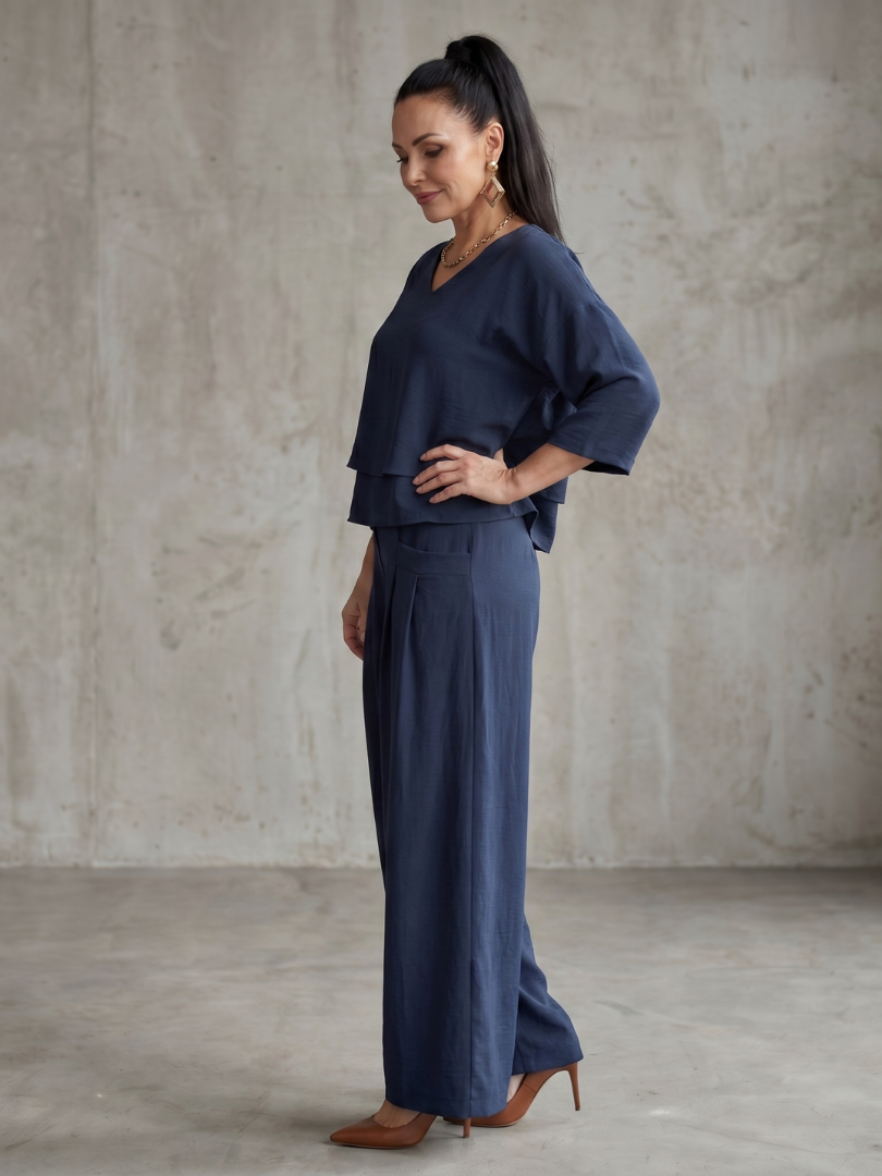 Navy layered V-neck top with wide-leg pants set, side view