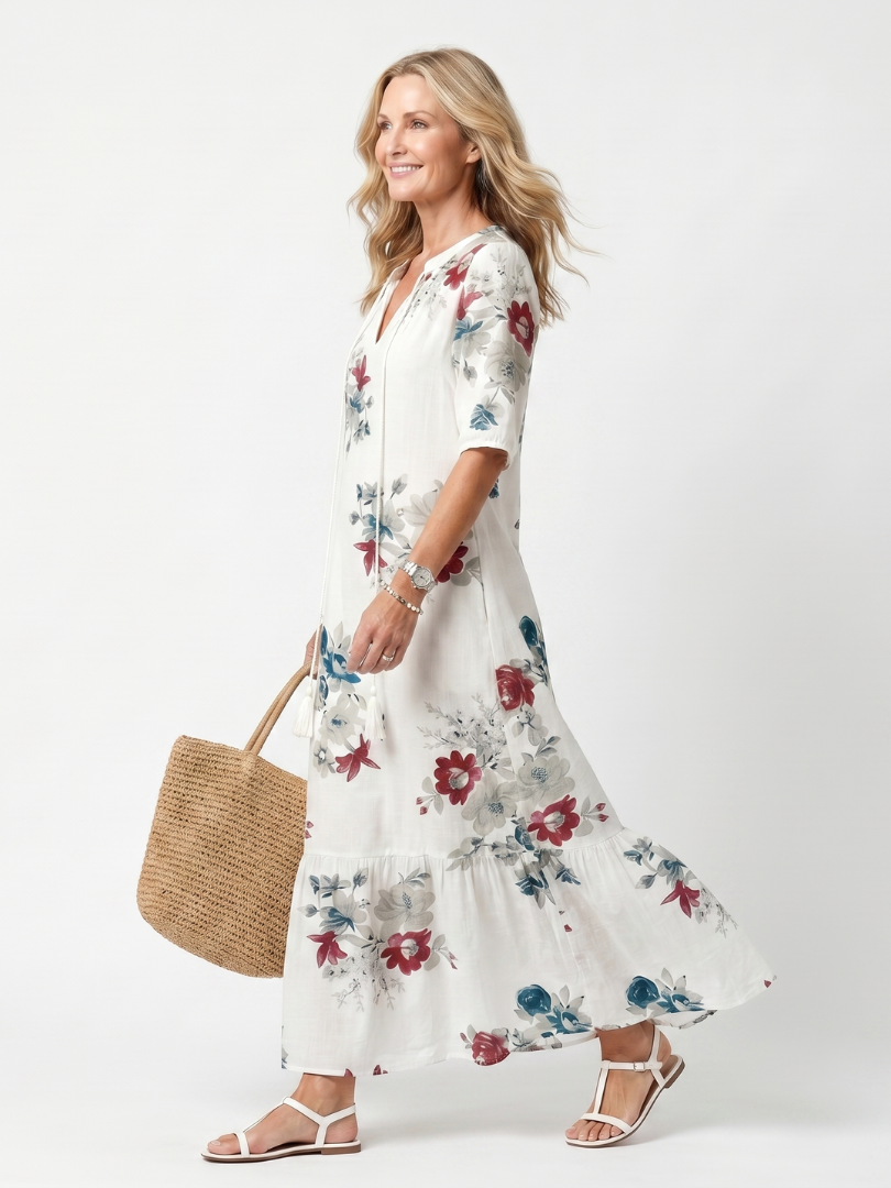 White floral midi dress with short sleeves and tiered skirt