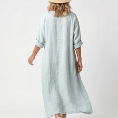 Sky blue pocket midi dress, back view, three-quarter sleeves and midi hem