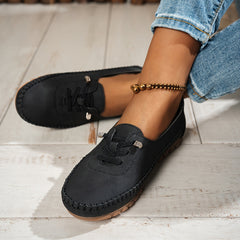 Mocassino flessibile comodo nero con nappine e suola spessa