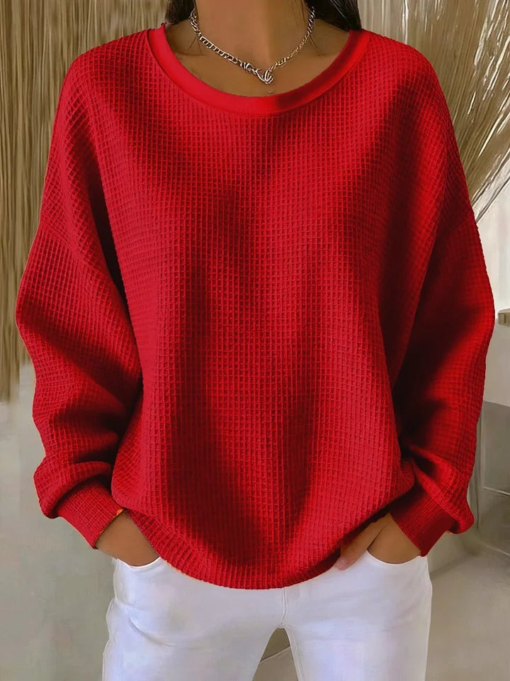 NYLA classic sweater in red waffle-knit, crewneck, long sleeves with ribbed cuffs.