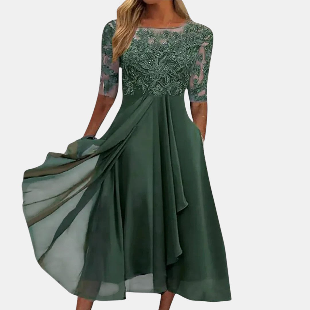 Abito elegante in pizzo verde con maniche corte e gonna svasata plissettata