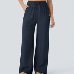 Navy wide-leg trousers with elastic waistband and drawstring ties
