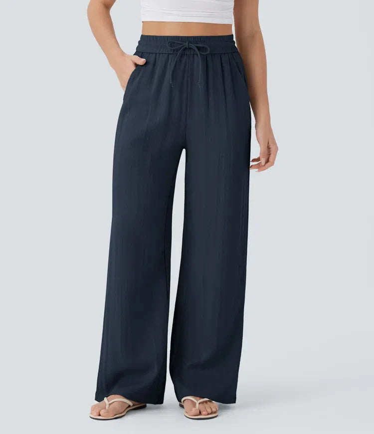 Navy wide-leg trousers with elastic waistband and drawstring ties