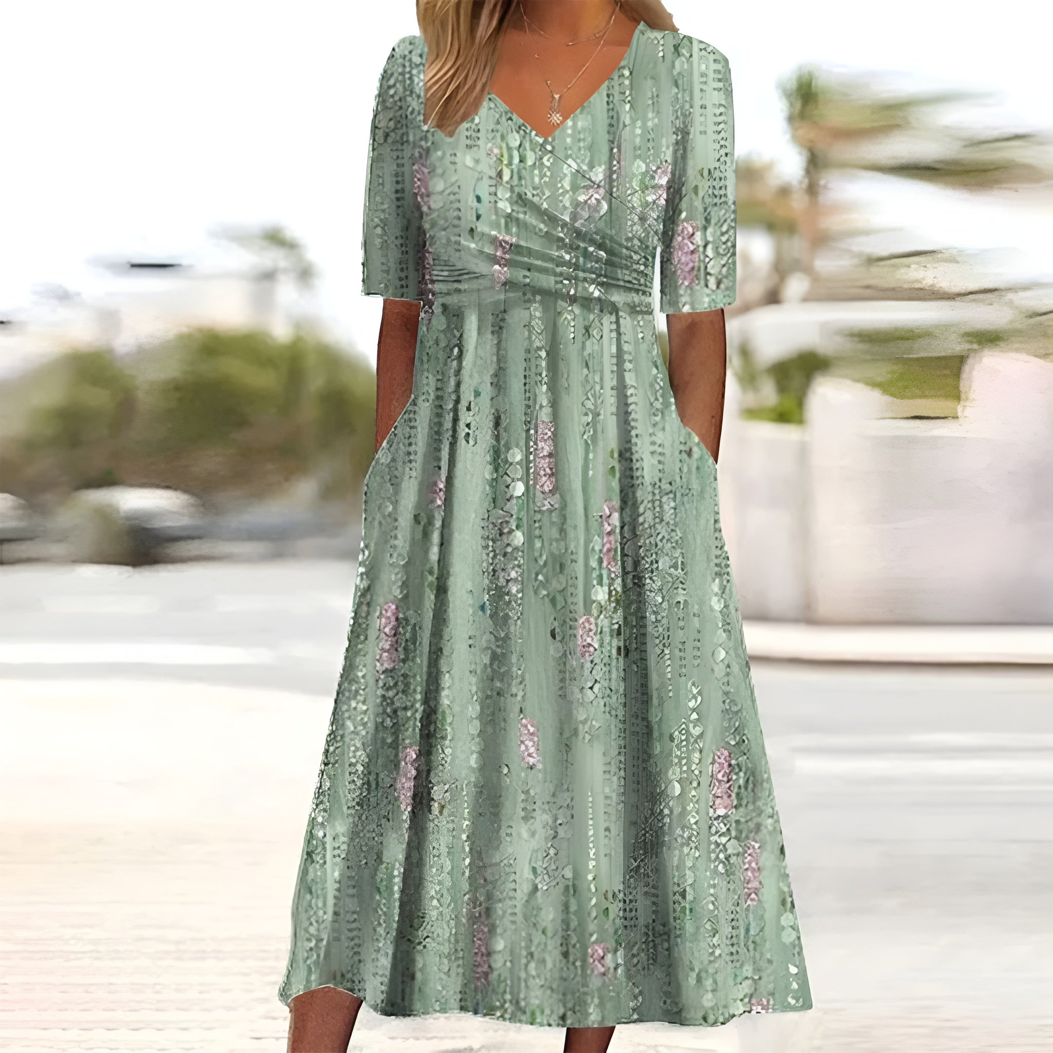 Vestito midi verde chiaro con scollatura a V, maniche corte e fantasia floreale rosa