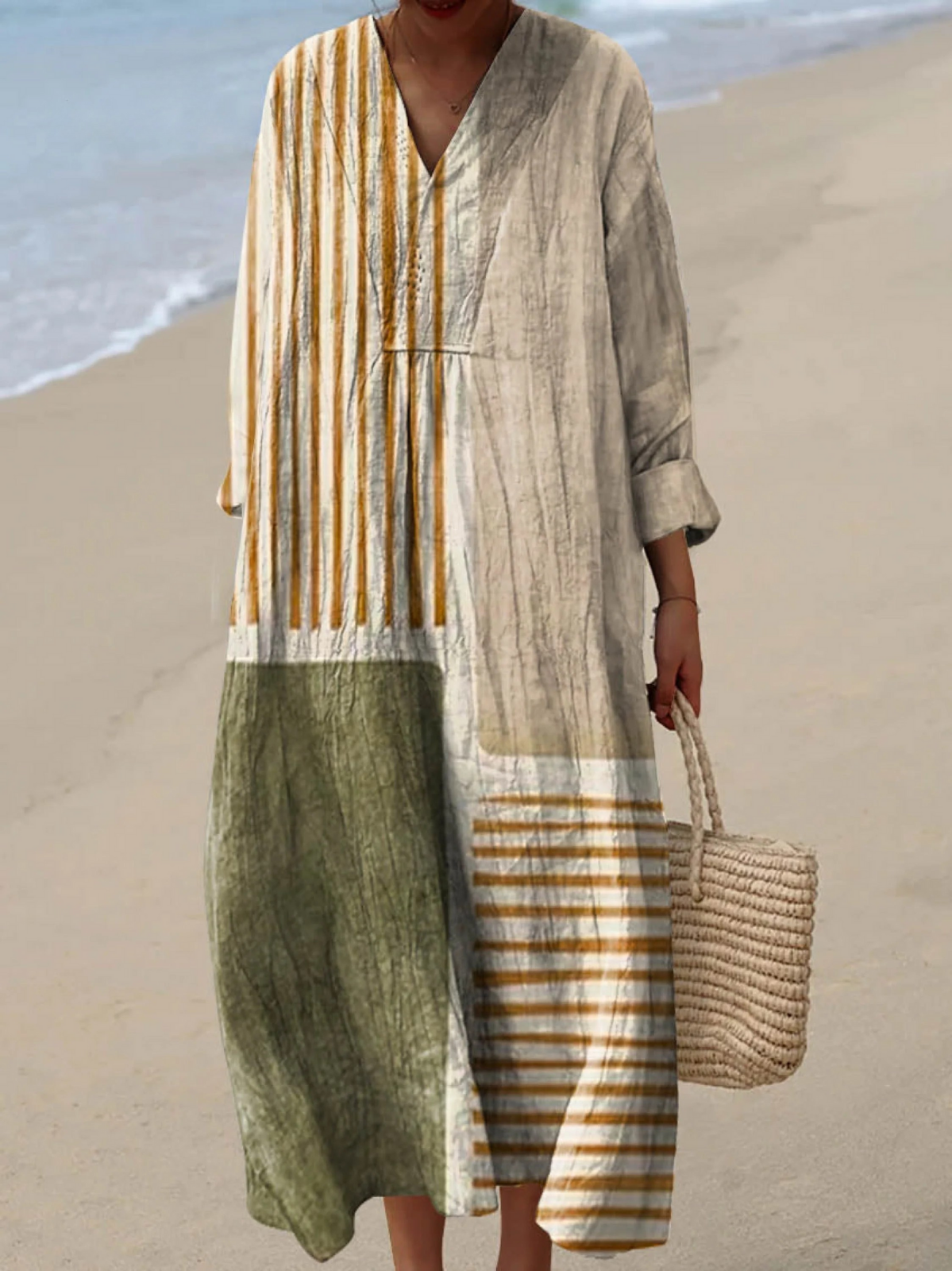 Boho maxi dress with V-neck, long sleeves, and patchwork stripe panels in gray and green