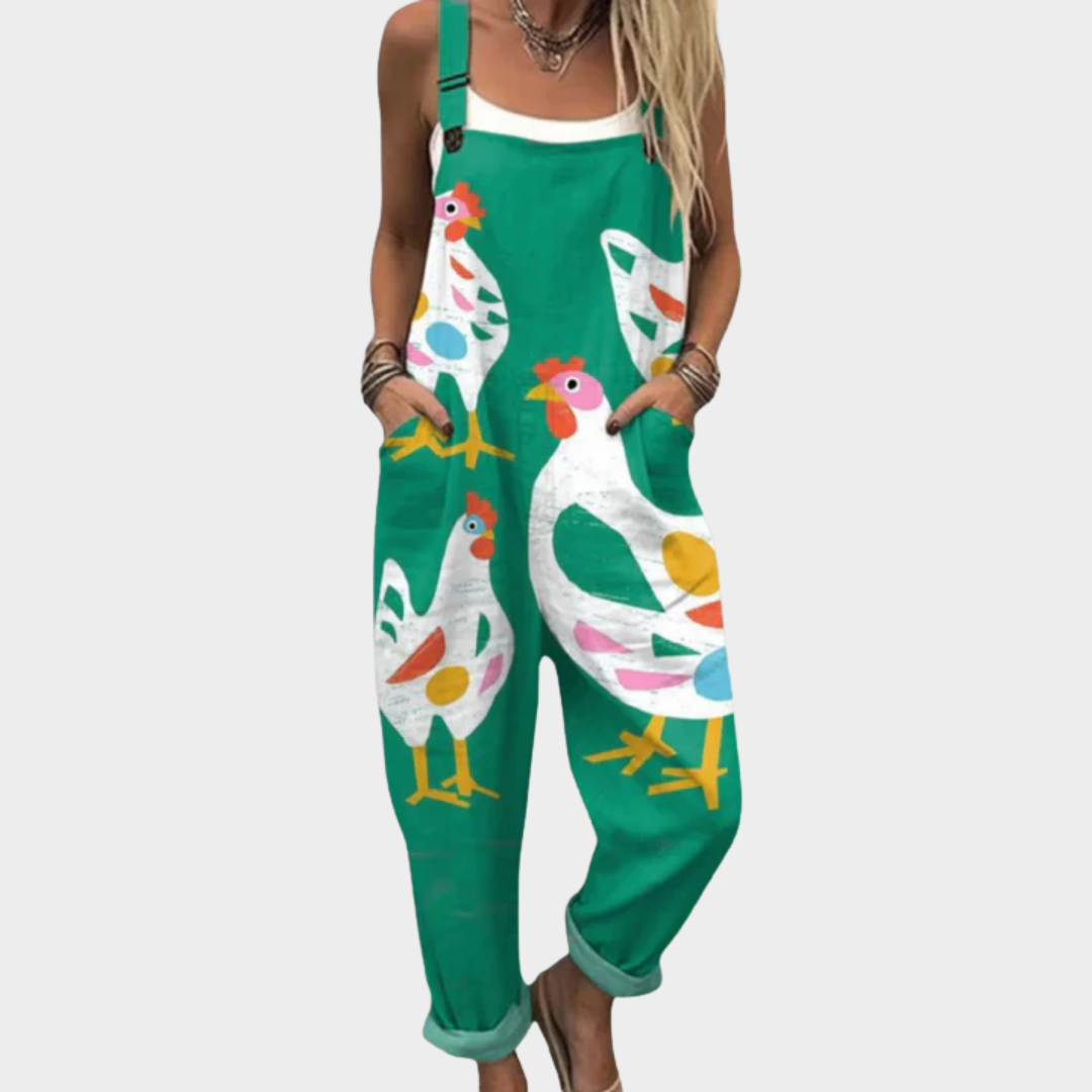 Green printed overalls with wide straps, bird pattern, and adjustable bib front