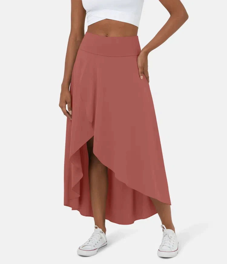 Asymmetric midi skirt in terracotta red with high-low hem and draped side panel