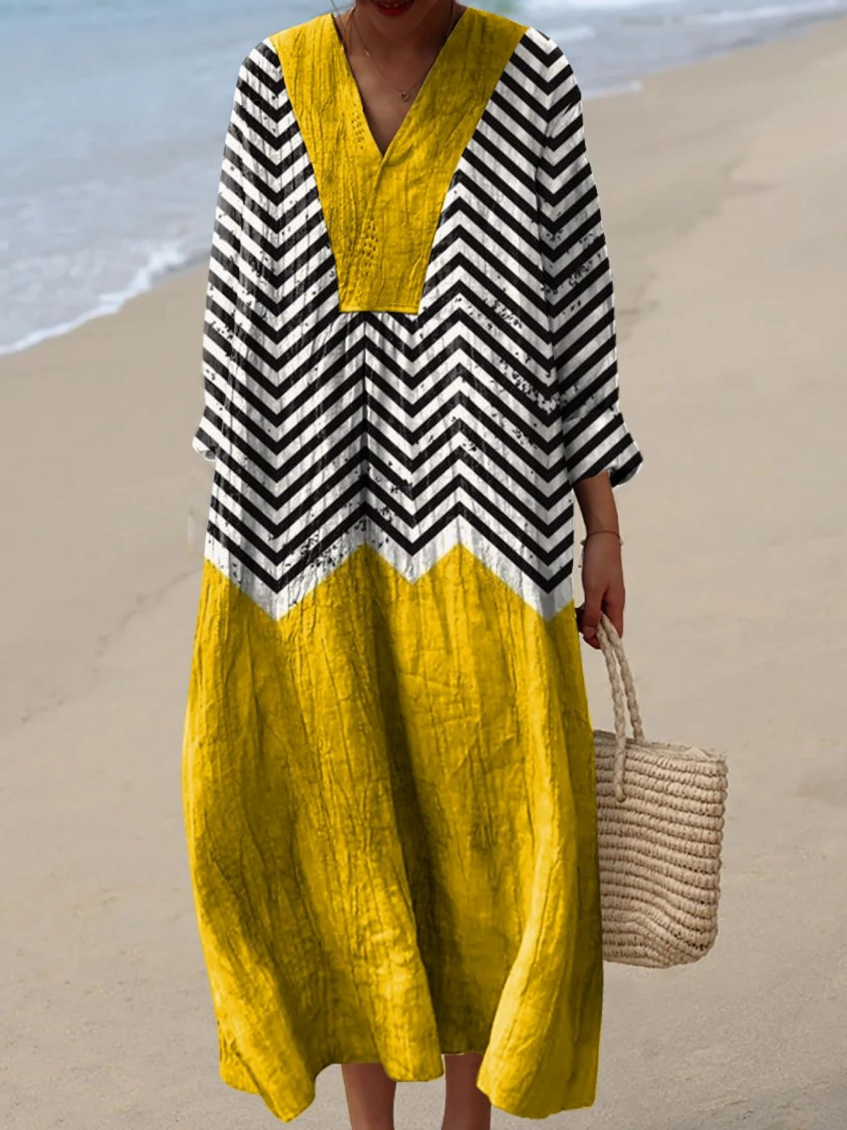 Boho maxi dress in mustard yellow with black-and-white chevron sleeves and yoke
