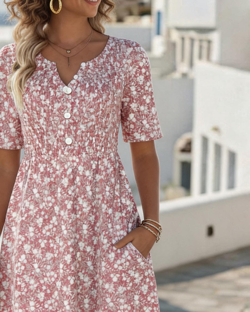 Abito midi floreale rosa con scollo a V, bottoni e maniche corte, vestibilità svasata