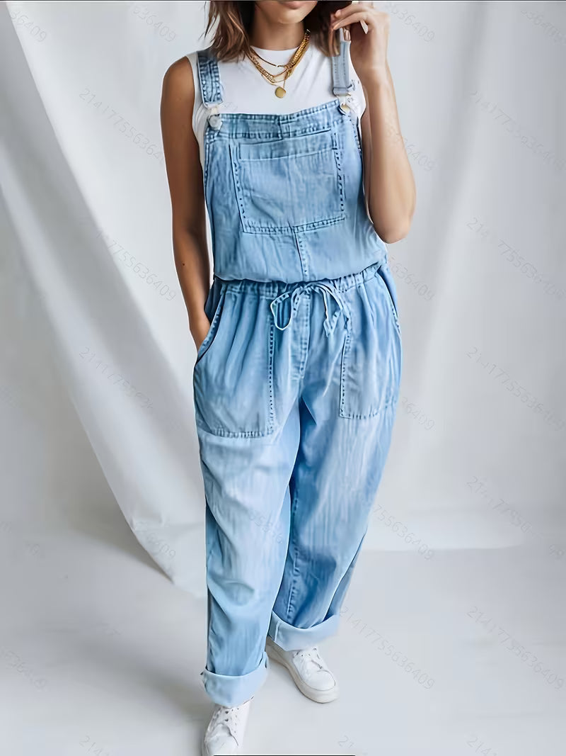 Blue denim relaxed wide-leg overalls with drawstring waist and bib front pocket