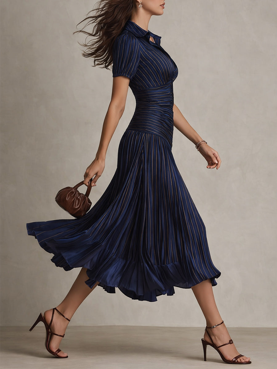 Dark blue striped satin midi dress from side, V-neck with short puff sleeves and pleated hem.