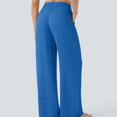 Royal blue wide-leg trousers with elastic waist and drawstring, straight wide legs.