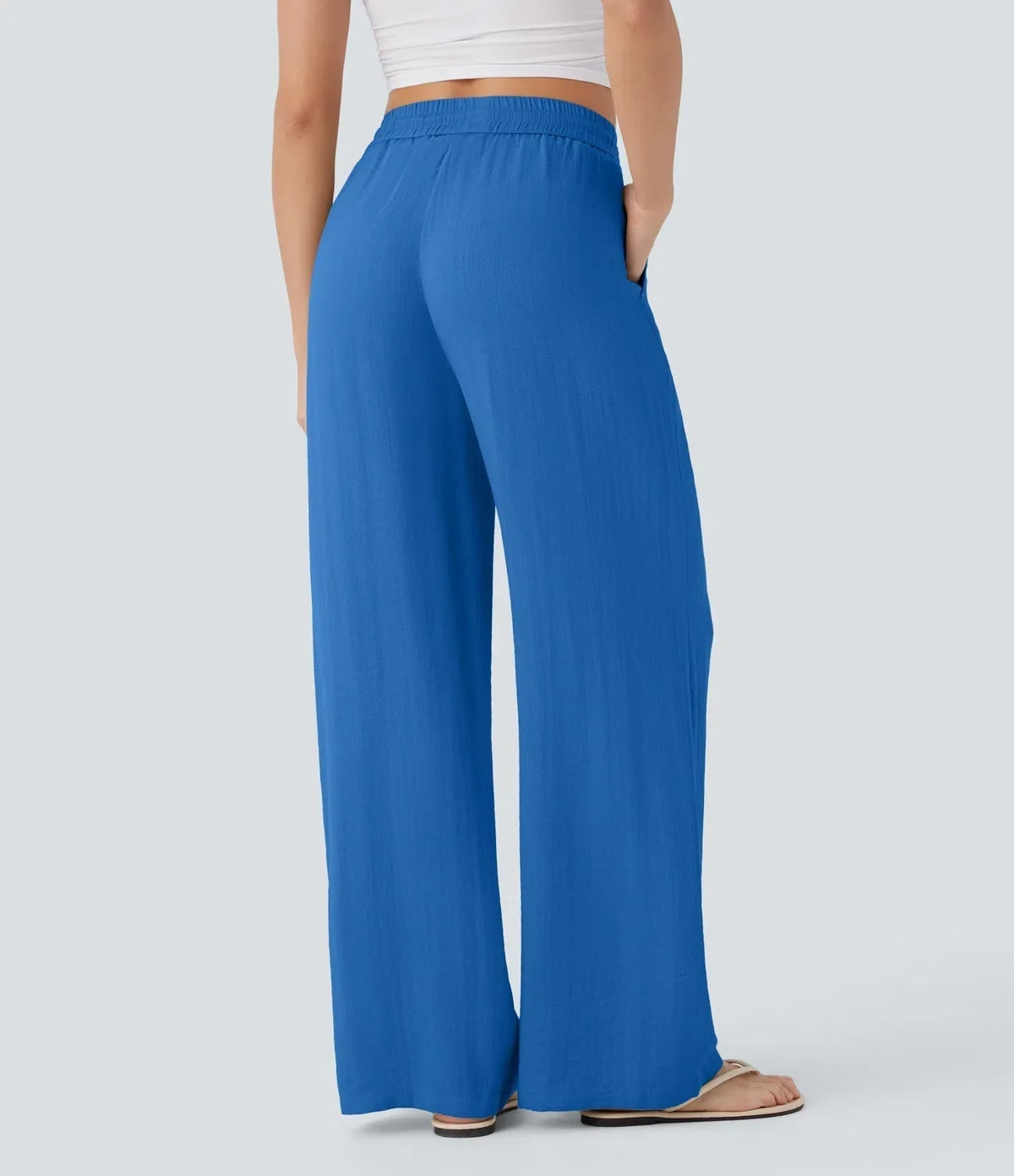 Royal blue wide-leg trousers with elastic waist and drawstring, straight wide legs.