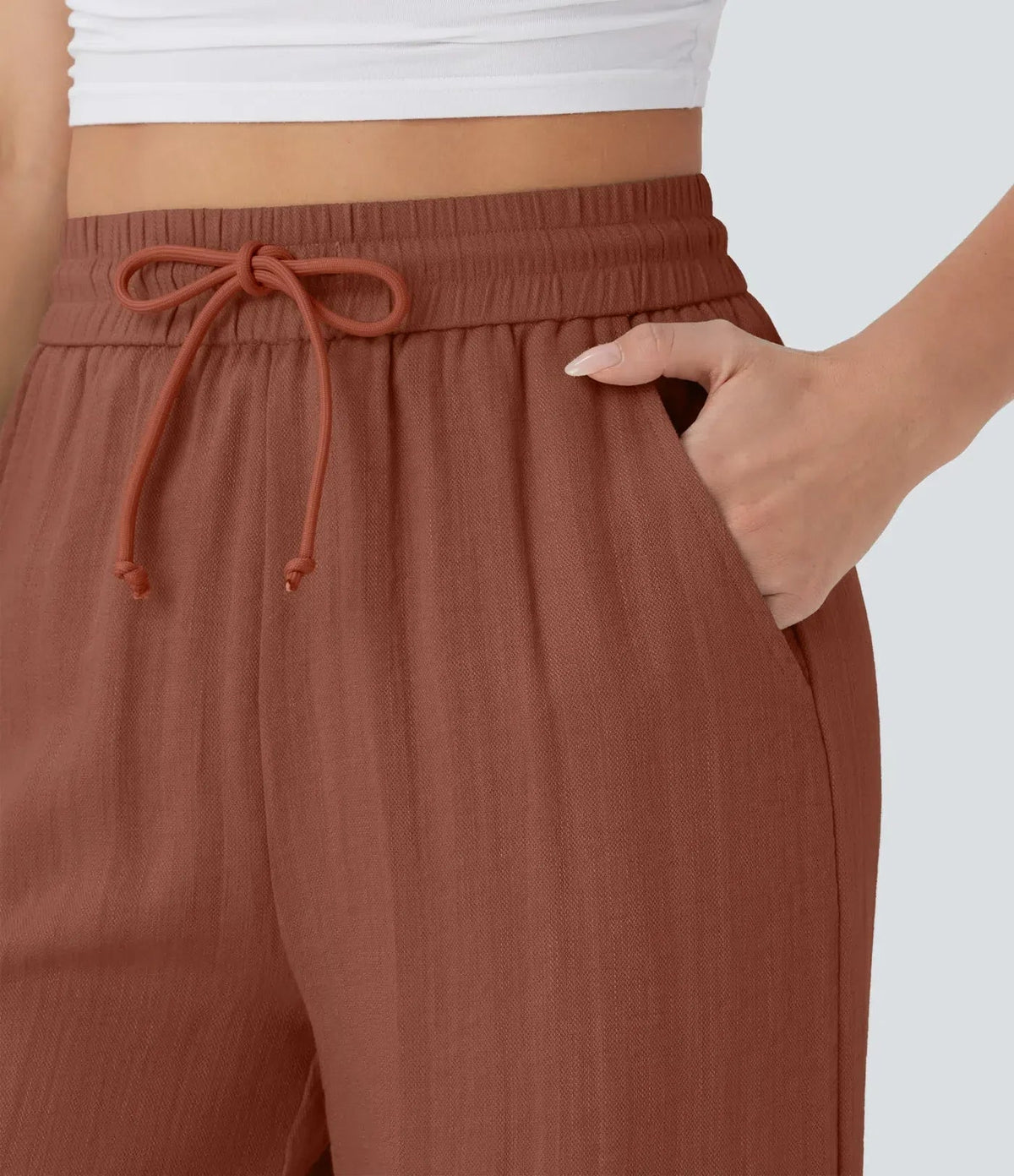 Rust wide-leg trousers with elastic waistband and drawstring tie