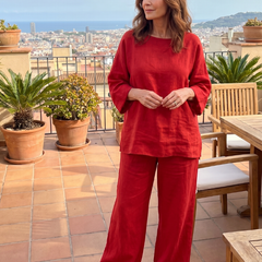 Red oversized tunic and wide-leg pants set, standing full-length view