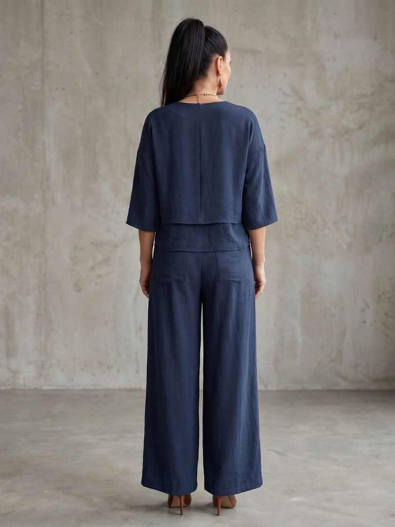 Navy layered top and wide-leg pants set, back view