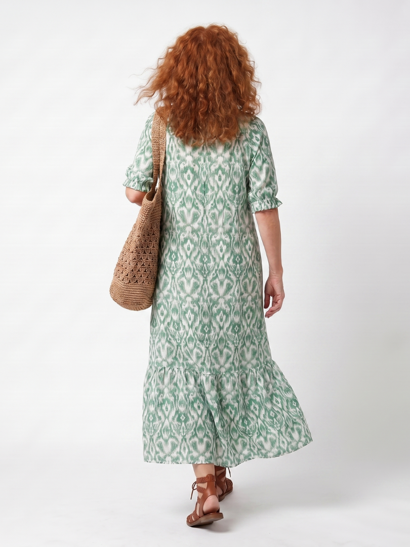 Green patterned V-neck midi dress, back view with three-quarter sleeves