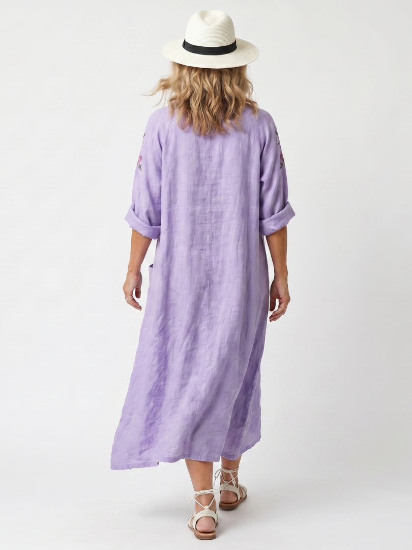 Purple oversized midi dress back view, relaxed fit with elbow sleeves and mid-calf length