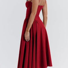 Abito corsetto rosso bordeaux, scollo posteriore e gonna midi a pieghe