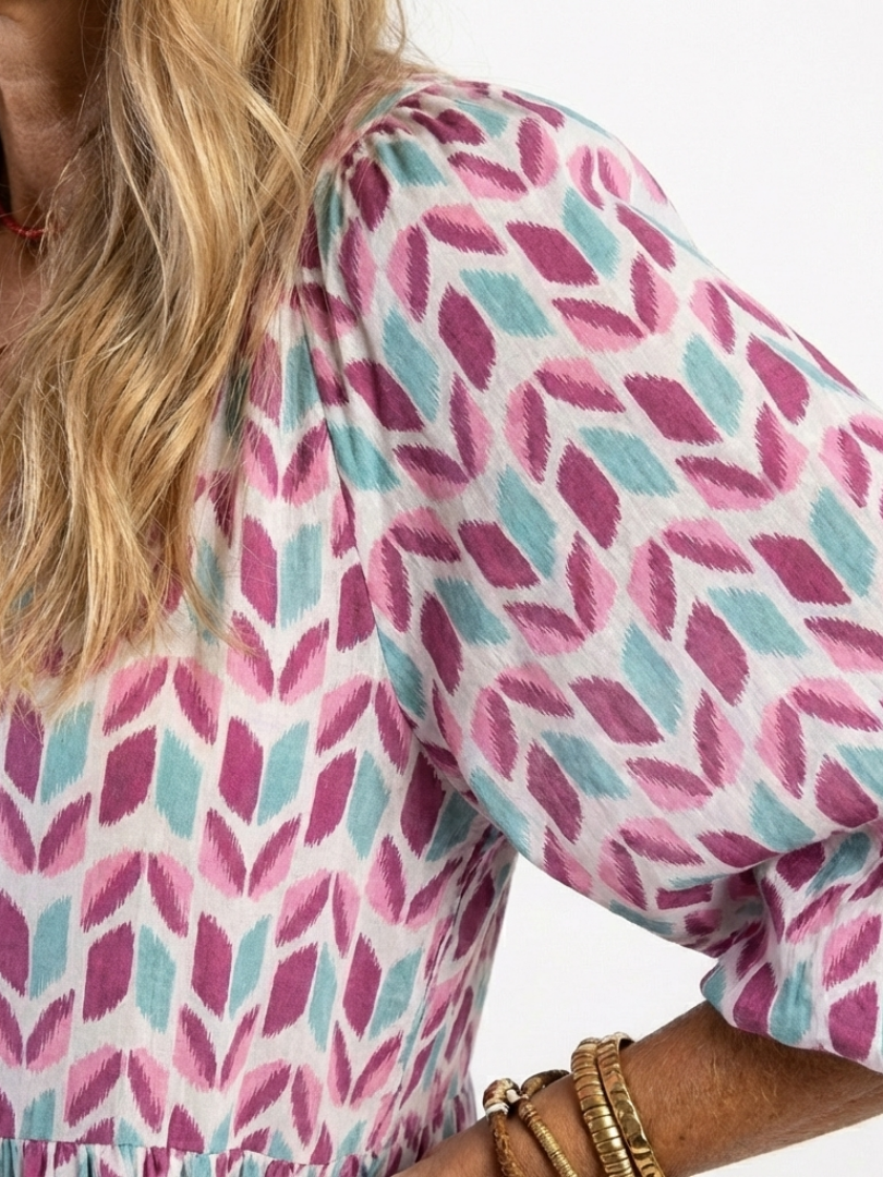 Geometric print dress top with V-neck and puff sleeve detail, lilac and teal