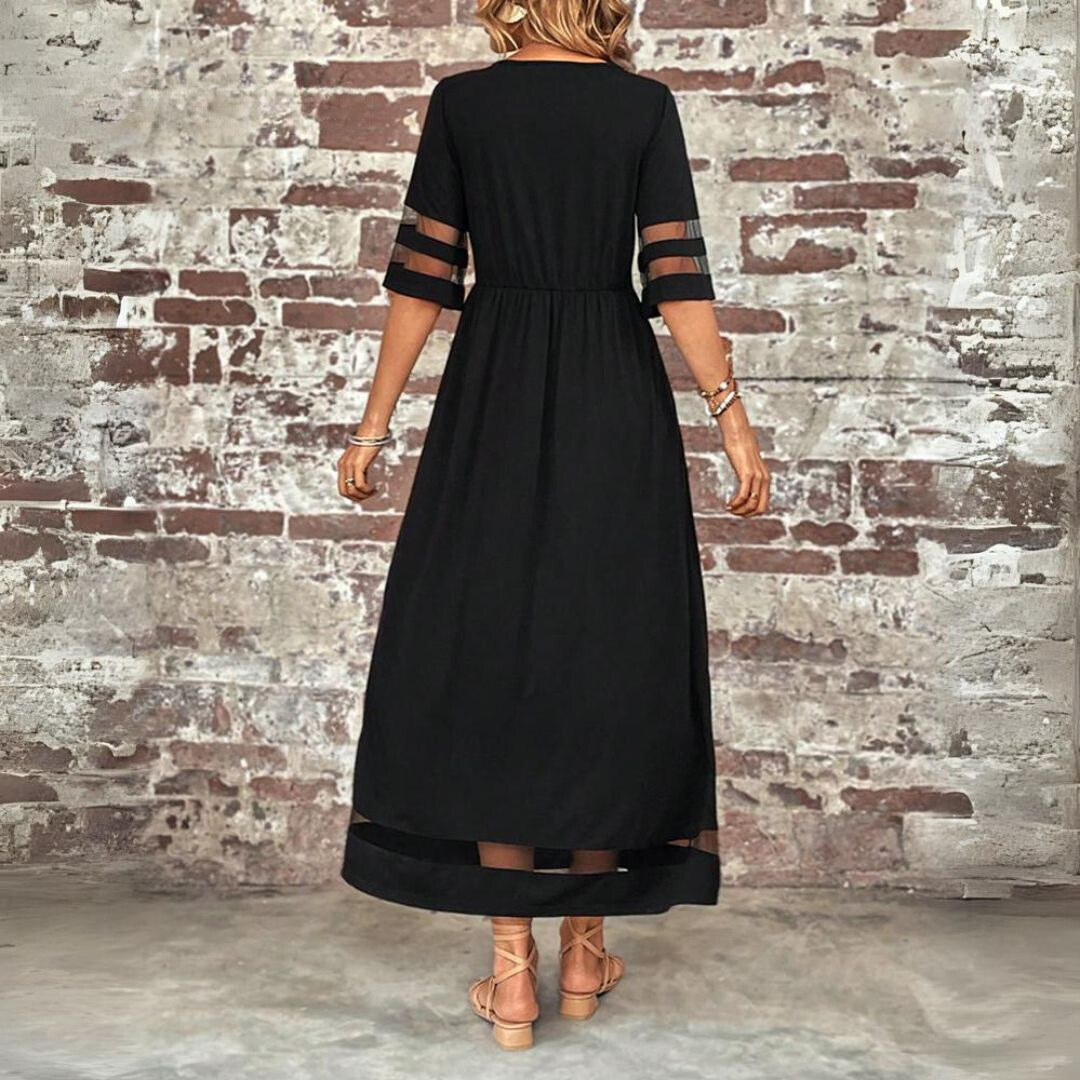 Black midi dress back view with gathered waist and sheer stripe sleeve and hem panels
