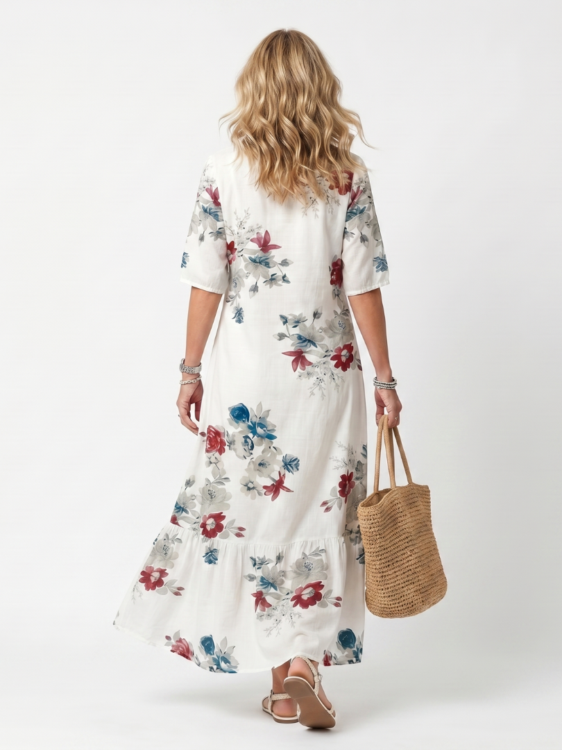 White floral midi dress, back view with short sleeves and tiered hem