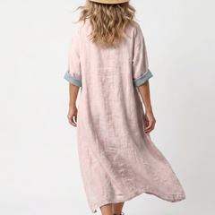 Pink midi dress back view with short sleeves and relaxed, flowy shape