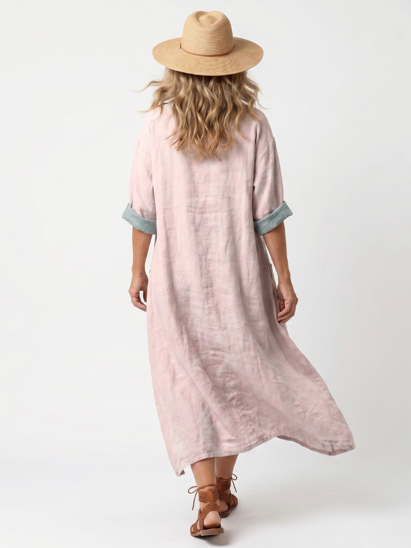Pink midi dress back view with short sleeves and relaxed, flowy shape