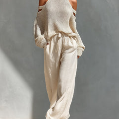 Camilla fashionable set: beige sleeveless turtleneck knit with cold-shoulder and wide-leg pants