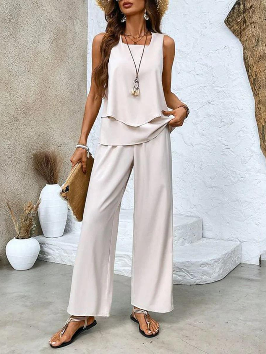 Completo estivo bianco: top senza maniche a balze e pantaloni palazzo