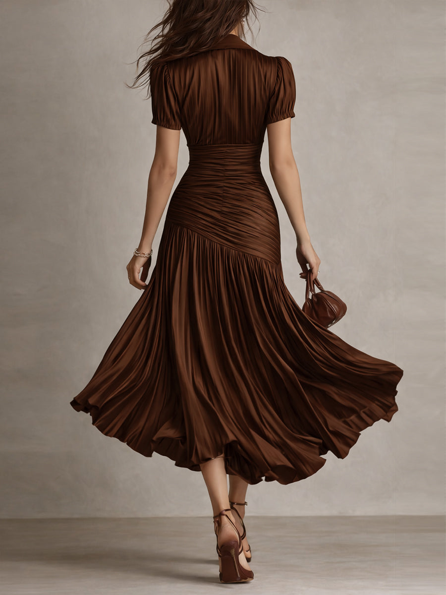 Brown striped satin midi dress from back, short sleeves, ruched waist, flared pleated hem.