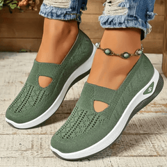 Scarpe antiscivolo ergonomiche verdi con suola bianca e tomaia a maglia traforata