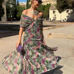 Abito da sera a fiori verde e viola, scollo bardot, gonna svasata con balze