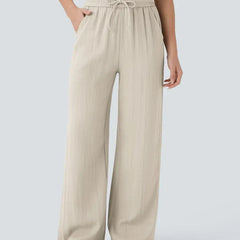 Beige wide-leg trousers with elastic waistband and drawstring ties