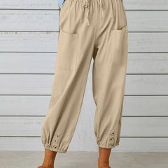 Khaki high-waist drawstring jogger trousers with side pockets and snap cuffs.