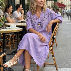 Purple embroidered midi dress with V-neck, puff sleeves and side pockets in relaxed drape