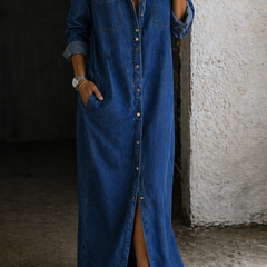 Dark blue denim button-through maxi dress with collar, chest pockets, and side slit